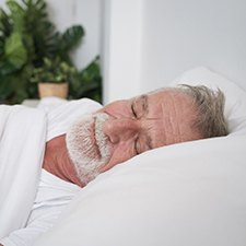 Man asleep with dental implants in Billerica