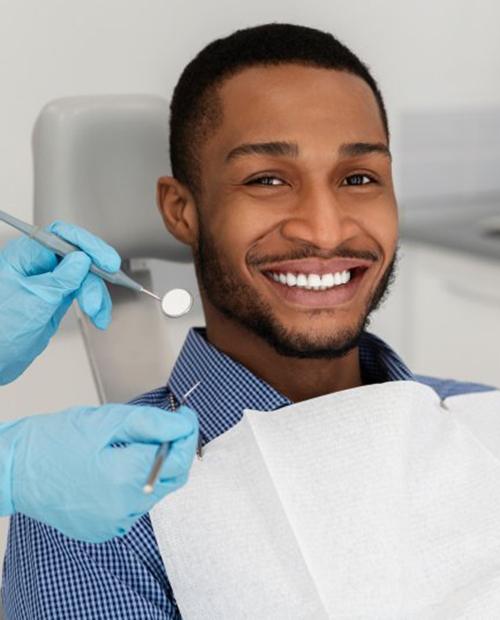 a patient smiling during his dental visit