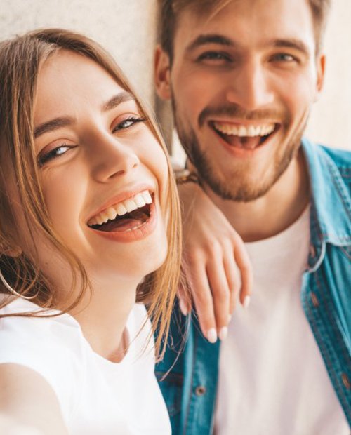 a couple laughing and smiling together