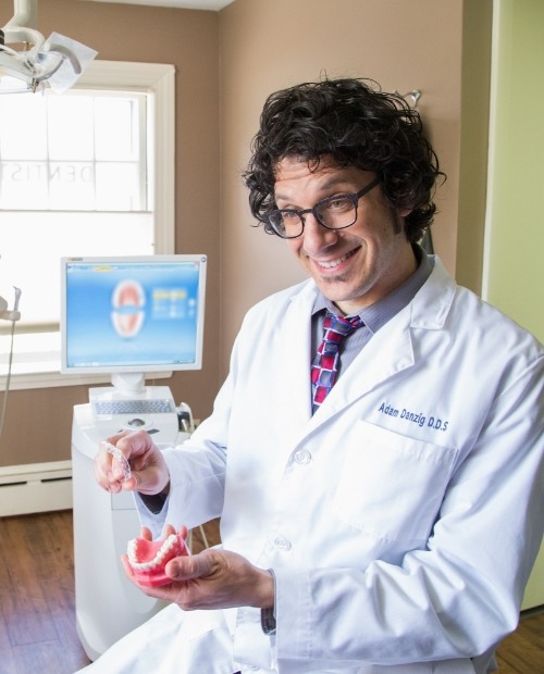 Dentist smiling in dental treatment room