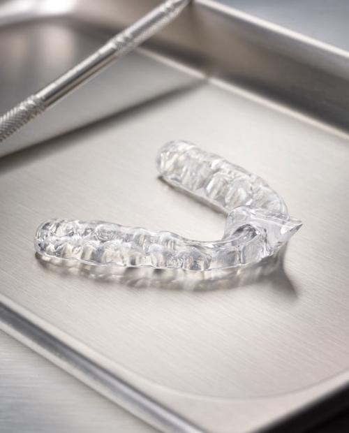 Clear nightguard for bruxism on metal tray