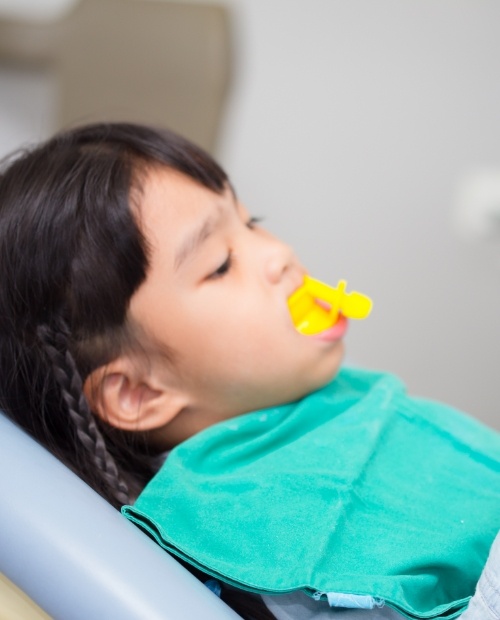 Child receiving fluoride treatment