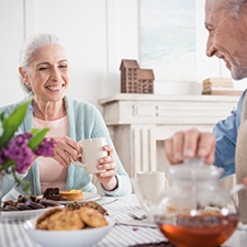 Older couple enjoying benefits of dental implants in Billerica