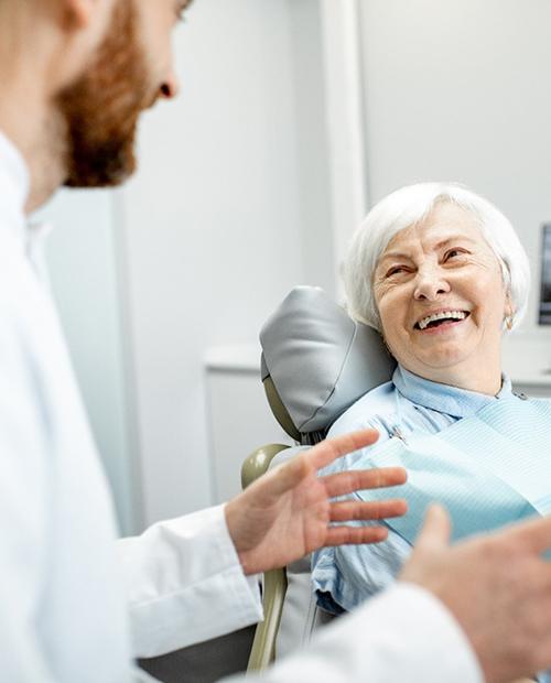 dentist talking to patient about dental implants in Billerica