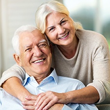 Couple smiles with dental implants in Billerica