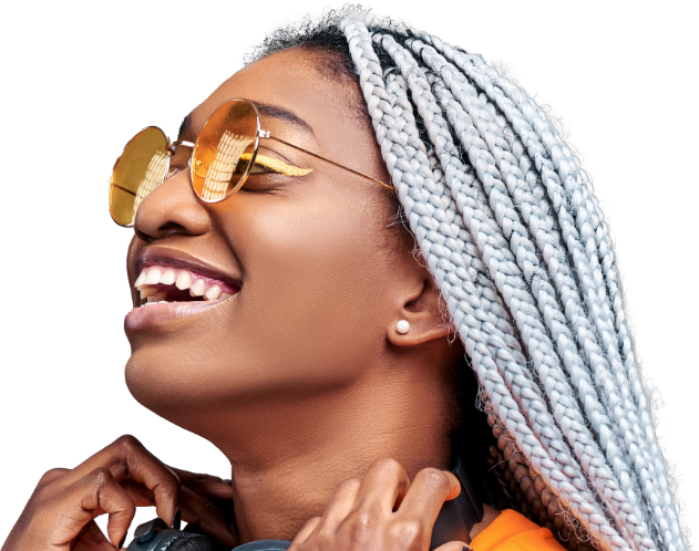 Smiling young woman with white locs looking to the left