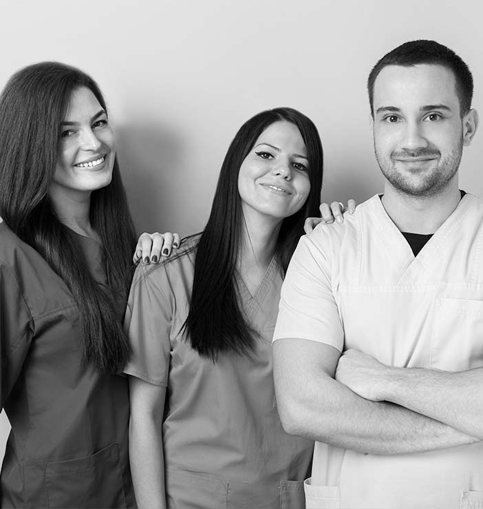 Black and white photo of three dental team members in Billerica