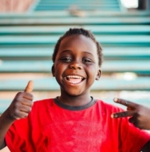 Child with healthy smile after children's dentistry