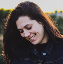 Woman with flwless smile after emergency dentistry