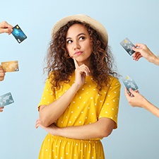 Woman surrounded by credit cards