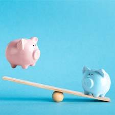 Piggy banks on balance scale