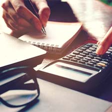 Woman calculating cost of veneers in Billerica