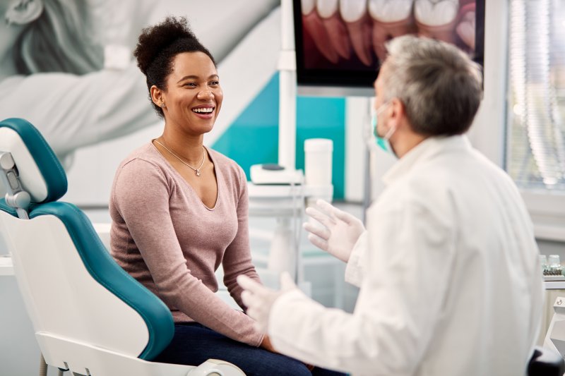 patient talking with dentist about smile makeover