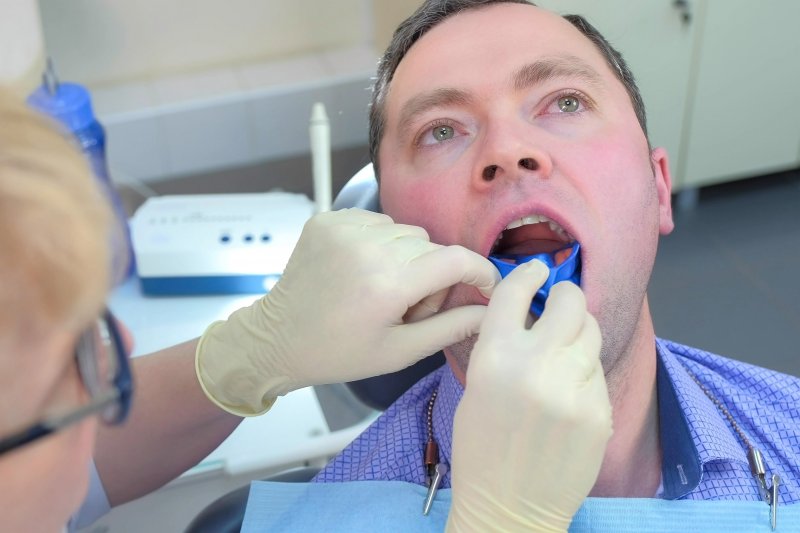 grown man receiving fluoride treatment