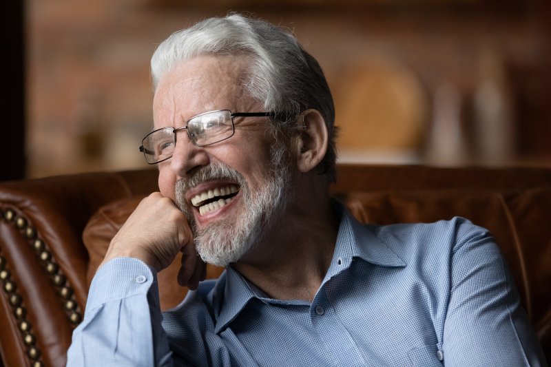 a man in Billerica smiling with his new dentures